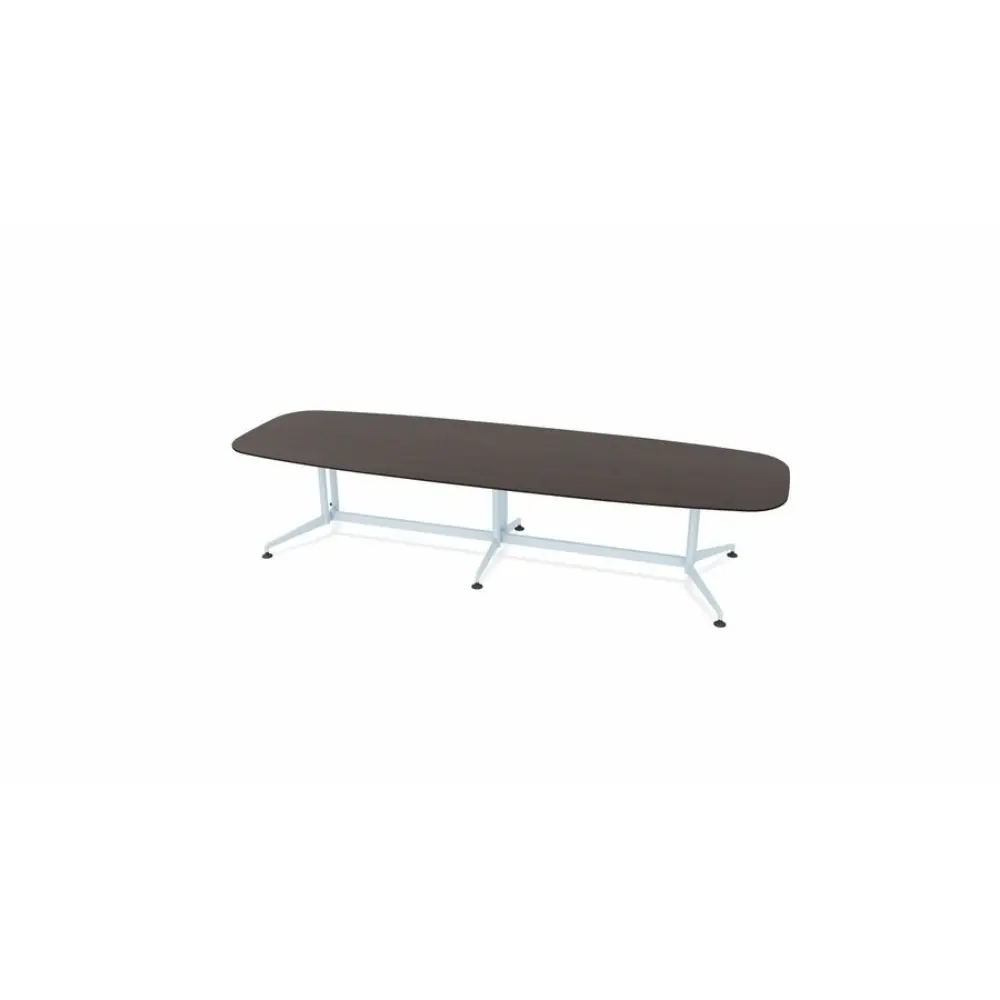 A long conference table with a dark wood top and metal legs, shown at an oblique angle