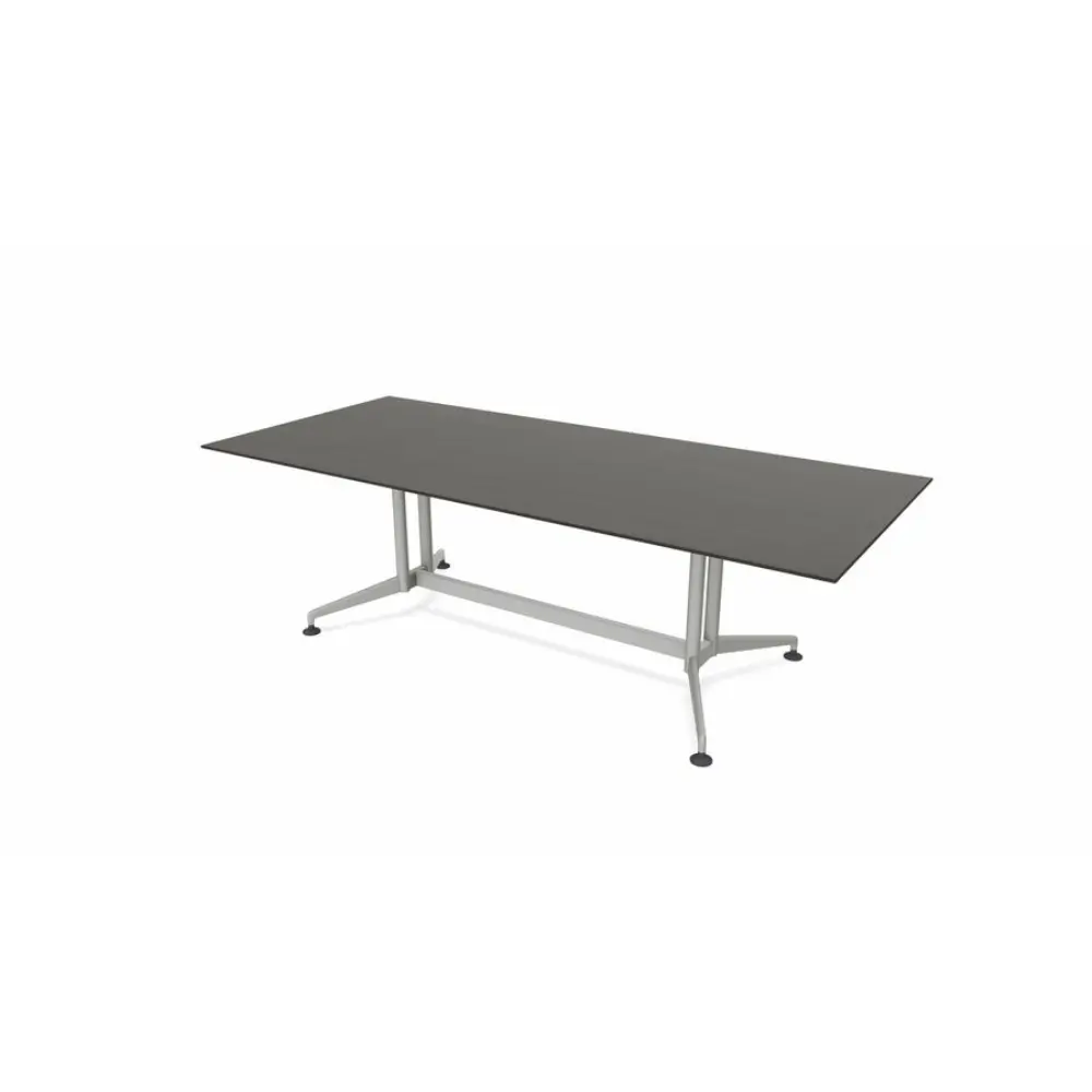 Longer rectangular table with dark top and silver trestle legs, used as conference/office table.