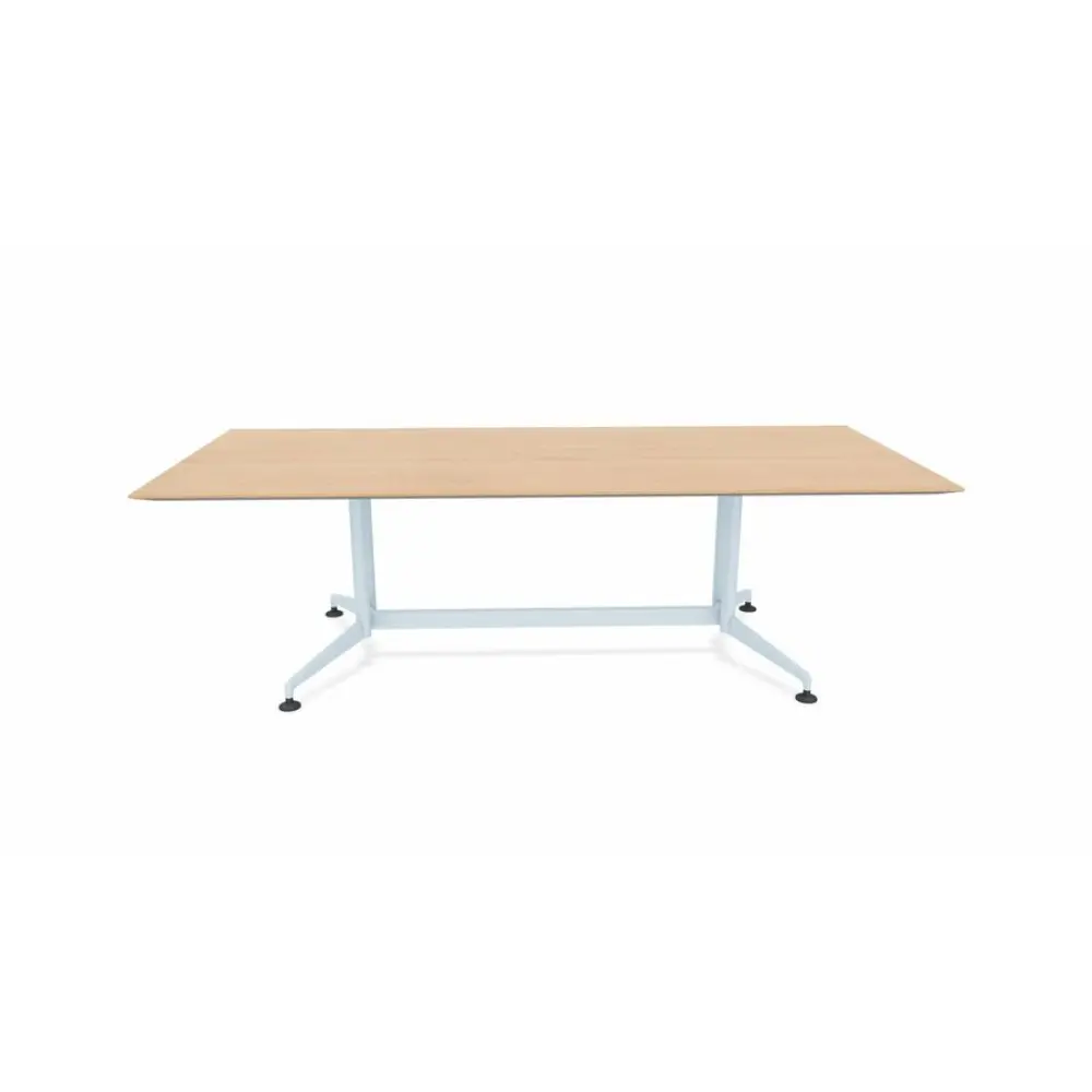 A longer rectangular wooden tabletop with a light wood finish and a metallic silver base with four legs on adjustable feet.