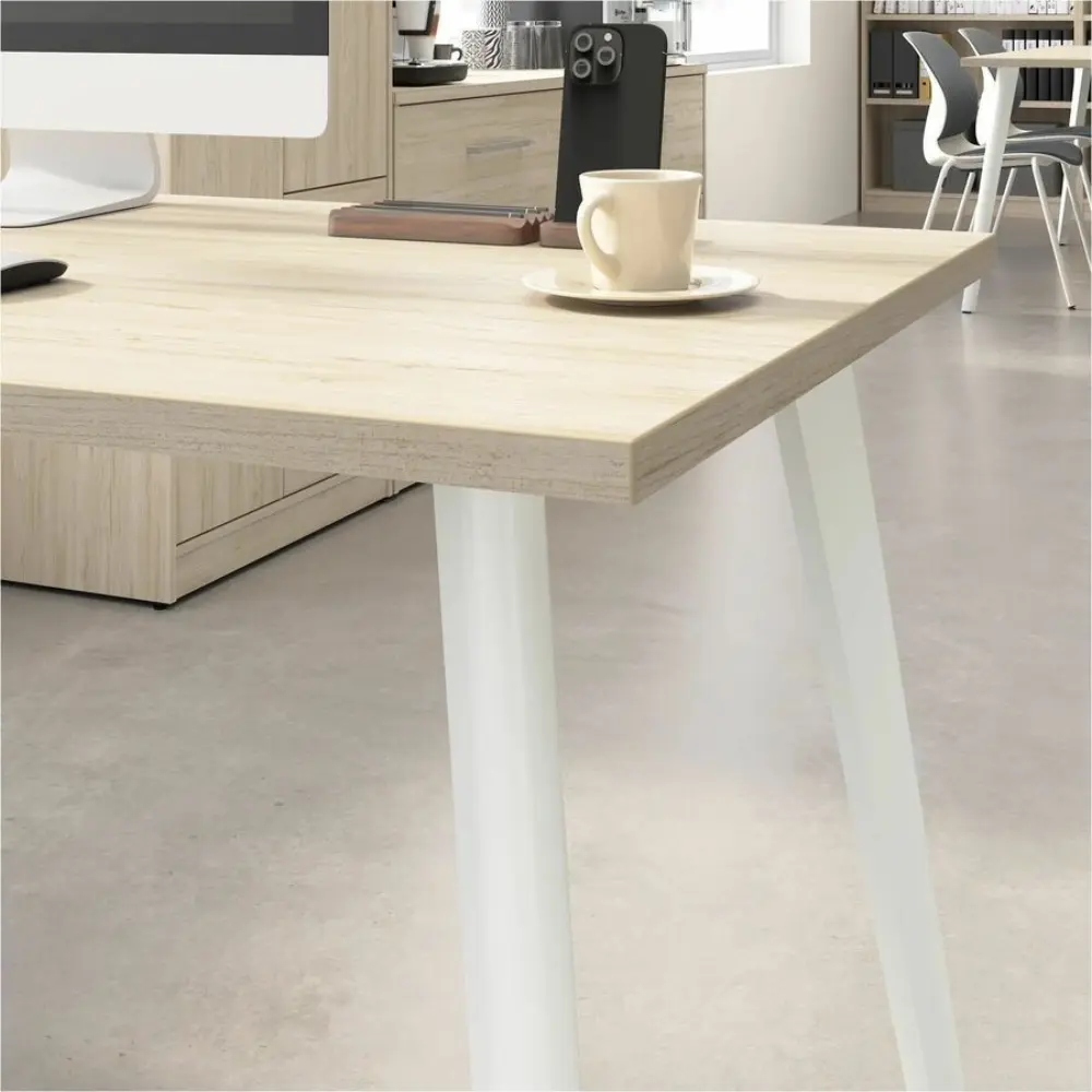 Top-down view of an L-shaped desk arrangement with monitors and accessories
