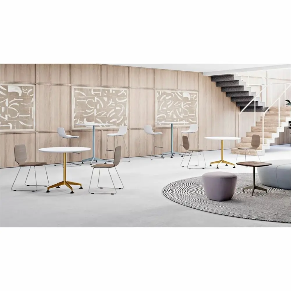 Round adaptive table with brown circular top mounted on a metal stand with a small bracket.