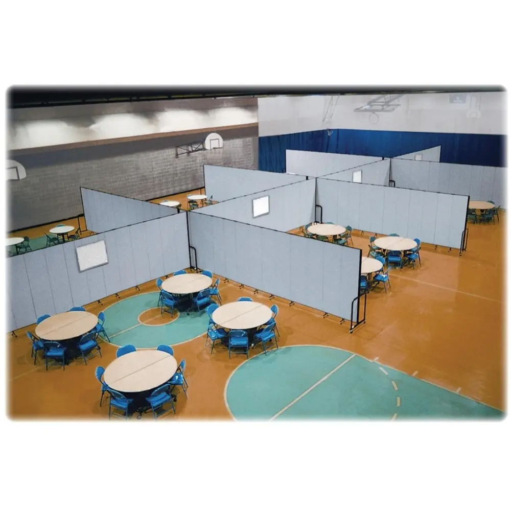 Large blue privacy panels on wheels arranged in a classroom or conference setup