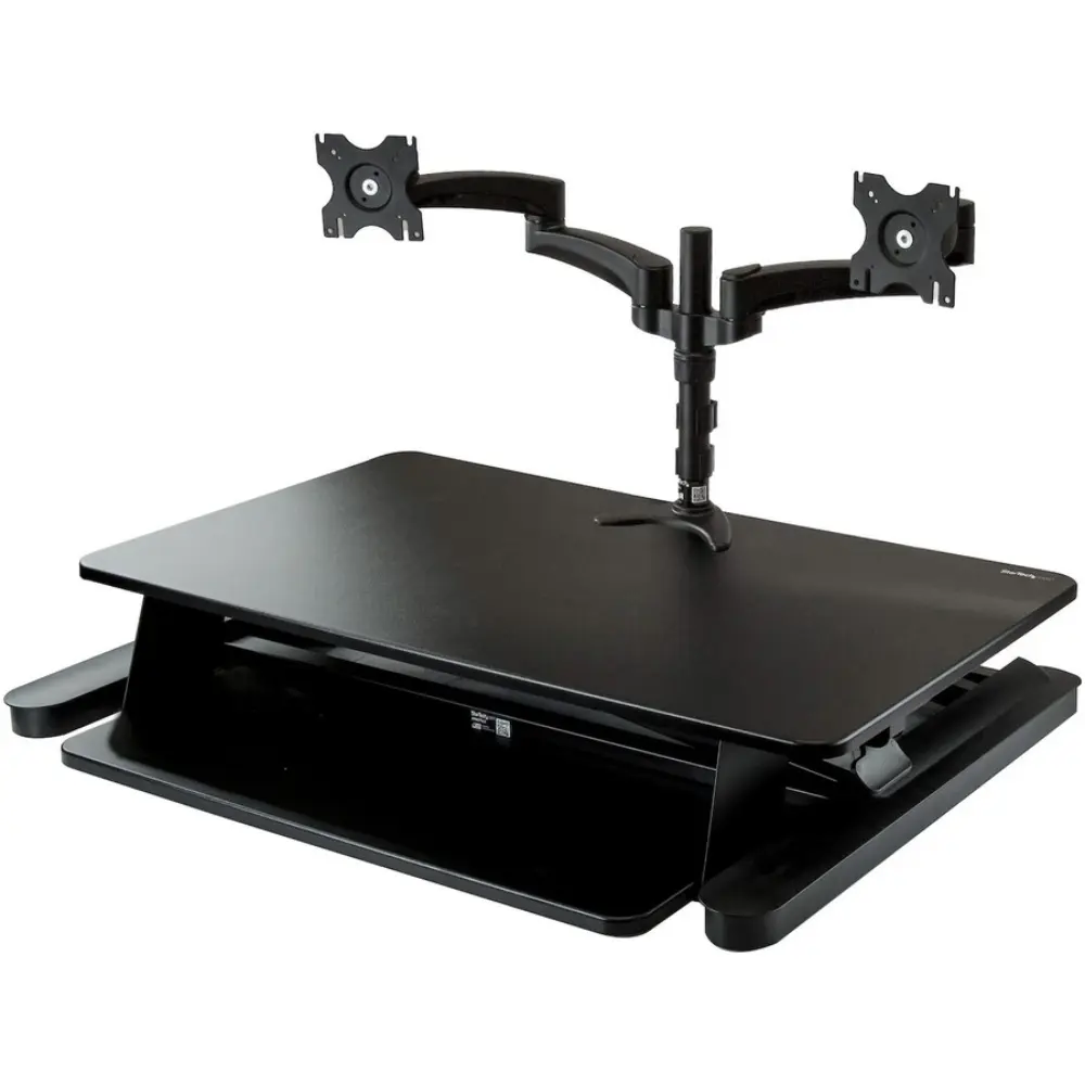 Ergonomic sit-stand workstation with split keyboard tray and a monitor arm.