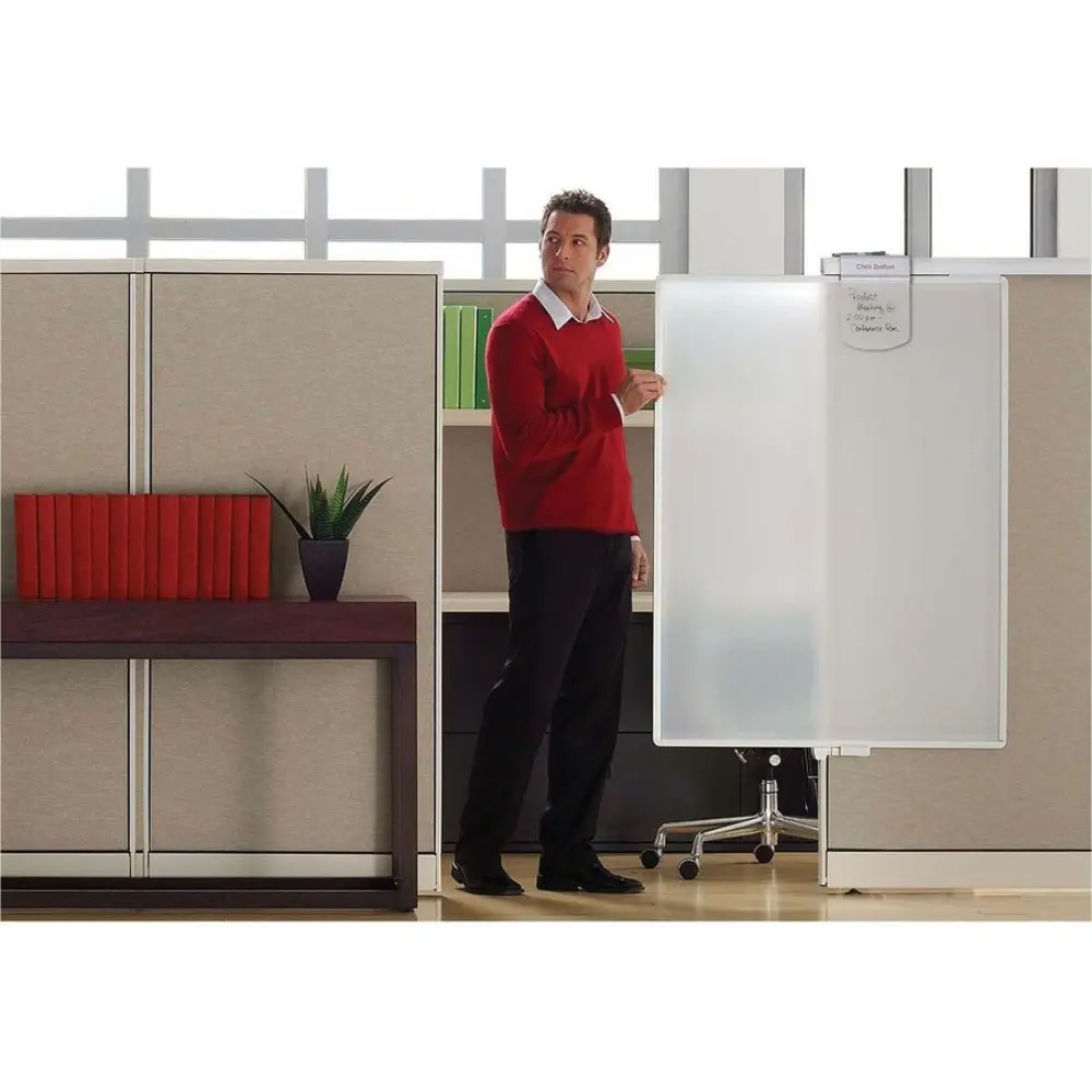 Large gray framed vertical panel with bushed texture on a cubicle