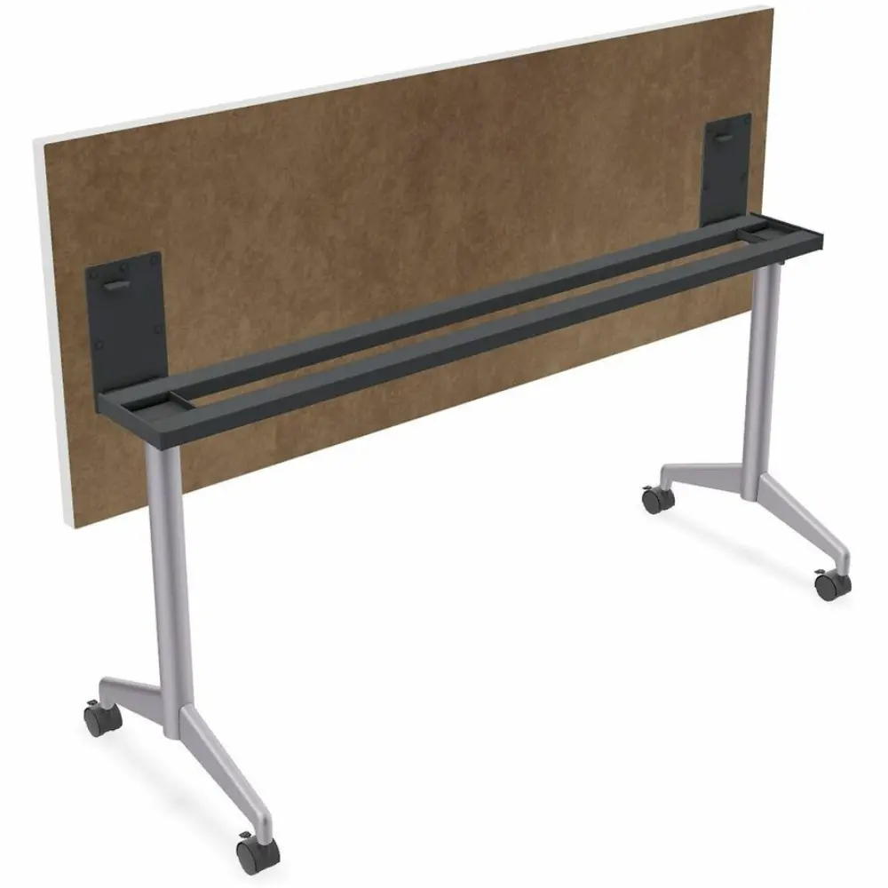 A white desk with a silver frame and black wheels.