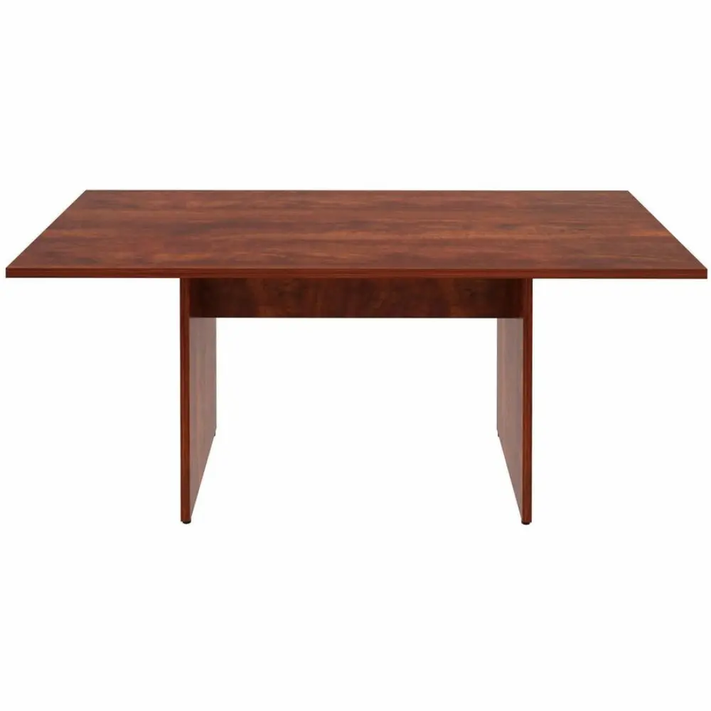 Close-up of a wooden table top displaying the rich wood grain.