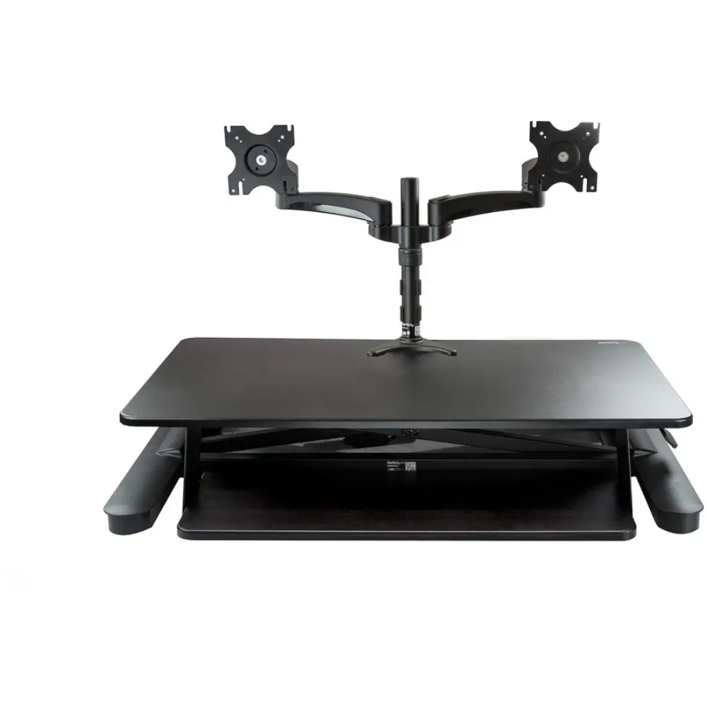 Dual-monitor standing desk with keyboard tray and scissor stand.
