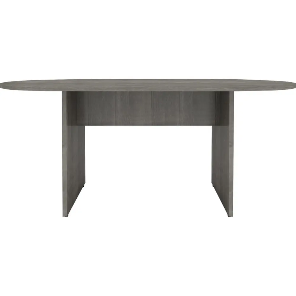 Close-up of the front panel and disk-like pedestal base of a gray wood oval table