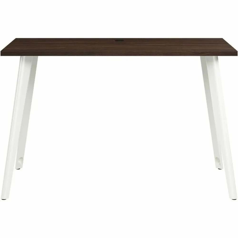 Close-up of desk edge and white leg with dark wood top