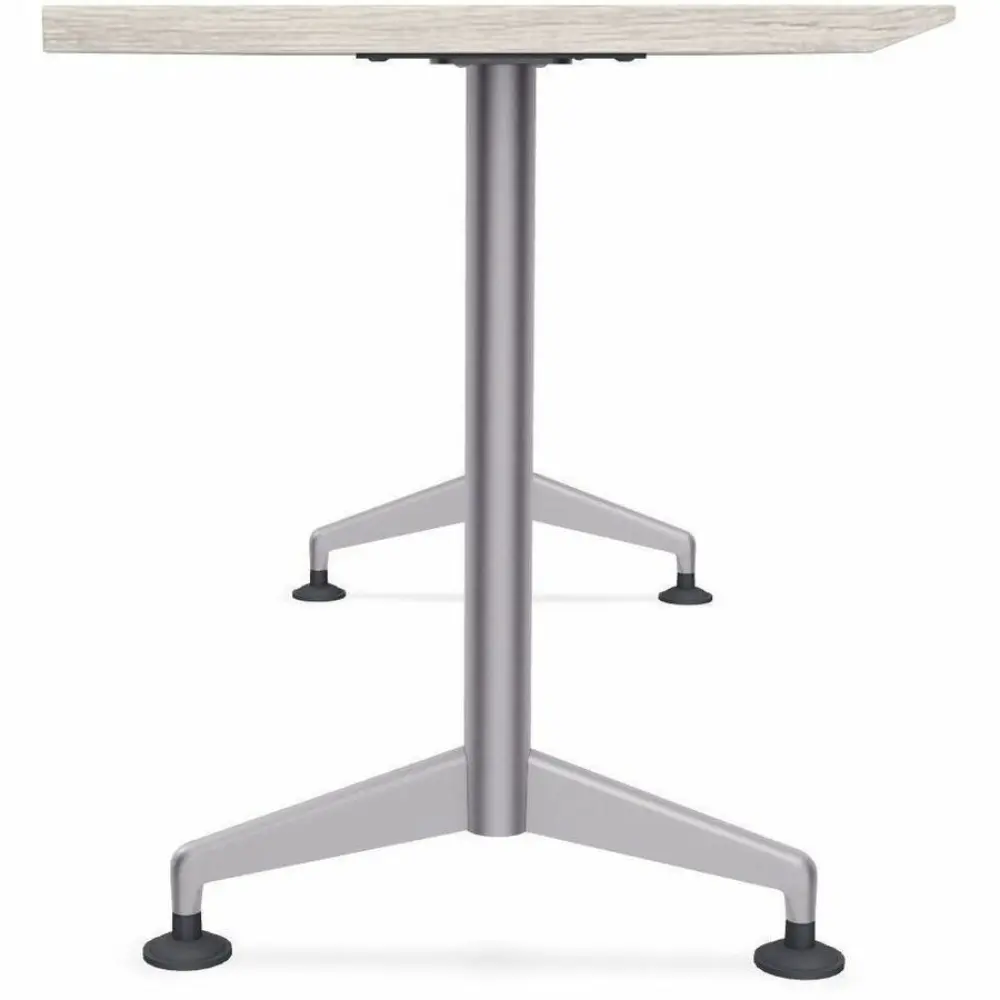 A two-tone light wood desk with metal pedestal legs and wheels