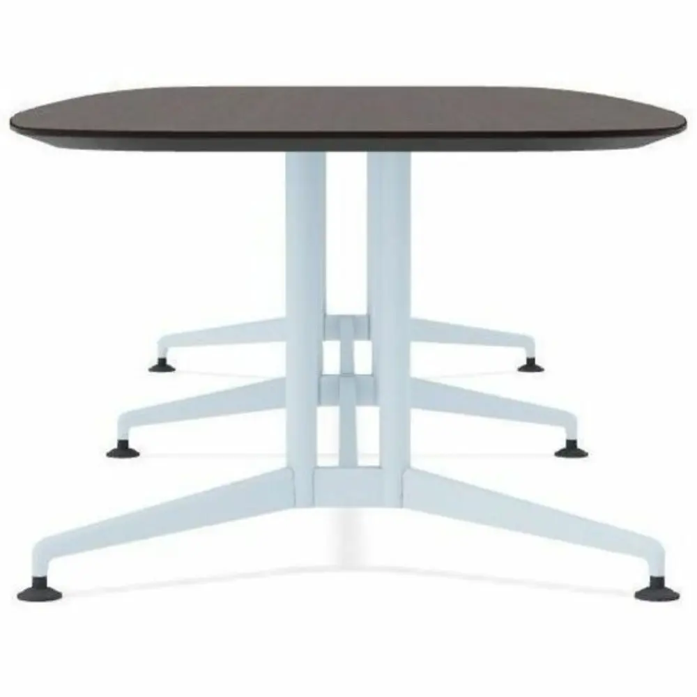 A long rectangular conference table with dark top and light blue base, viewed from the side