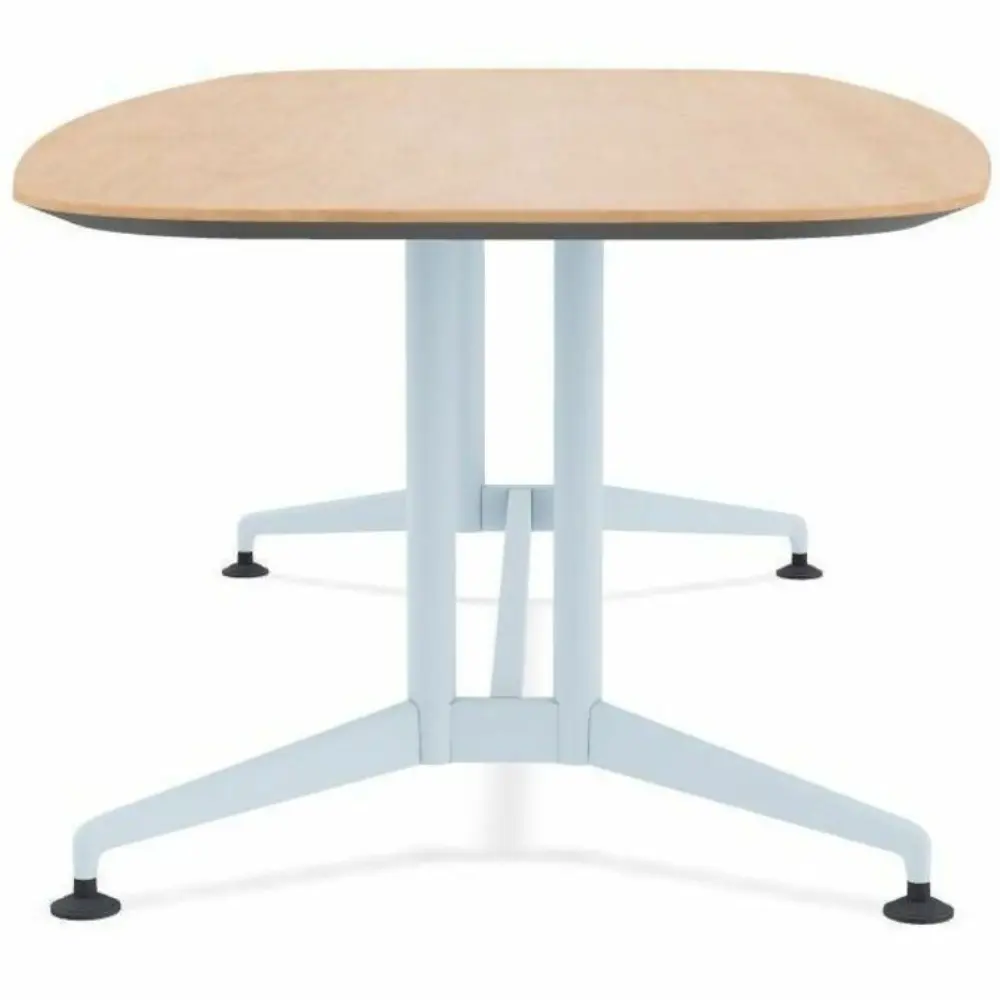 Low angle view of a long rectangular table with pale blue metal legs and T-shaped base
