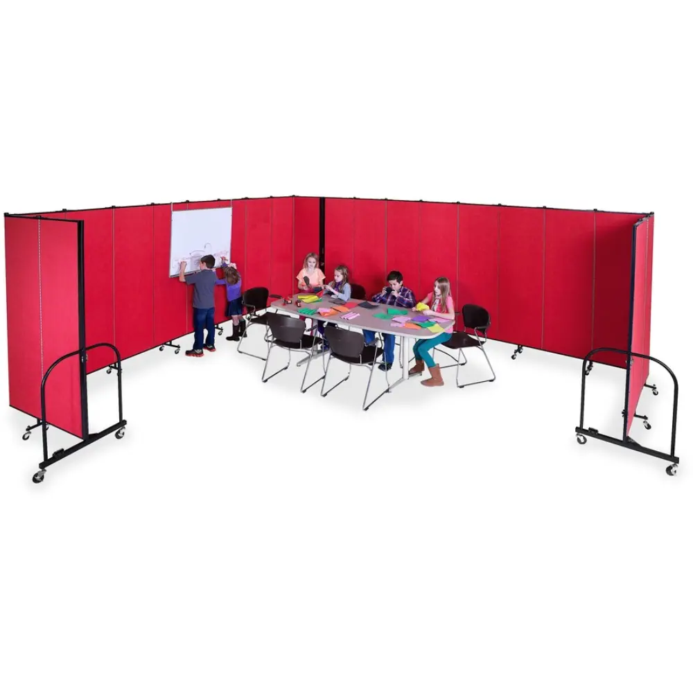 Person sitting at a desk with a folding grey divider behind