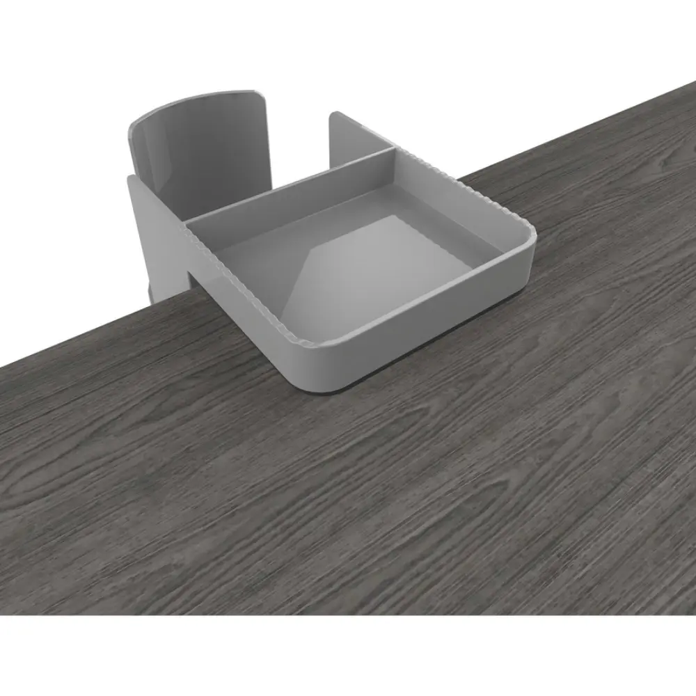 Stainless steel tumbler in a cup holder attached to desk