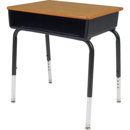 A bright classroom with yellow walls, small desks arranged in rows, a teacher desk at the front with a chair and supplies