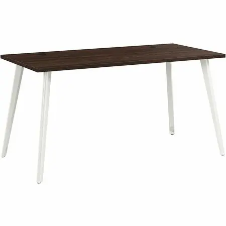 A modern office desk with dark wood top and white angled legs, keyboard tray, and a monitor stand visible.